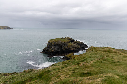 Scenic coastal landscape near Carrick-a-Rede Rope Bridge on the famous Causeway Coast Route in County Antrim, Northern Ireland