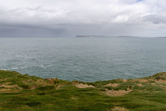 Stunning coastal cliffs and turquoise waters along the Northern Irish coast