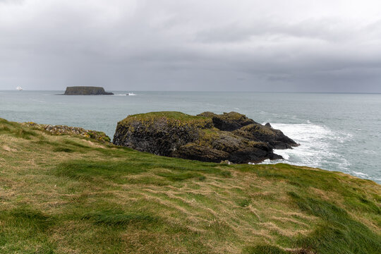 Scenic coastal landscape near Carrick-a-Rede Rope Bridge on the famous Causeway Coast Route in County Antrim, Northern Ireland