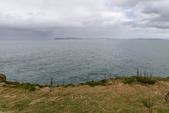 Stunning coastal cliffs and turquoise waters along the Northern Irish coast