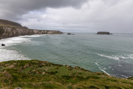 Scenic coastal landscape near Carrick-a-Rede Rope Bridge on the famous Causeway Coast Route in County Antrim, Northern Ireland