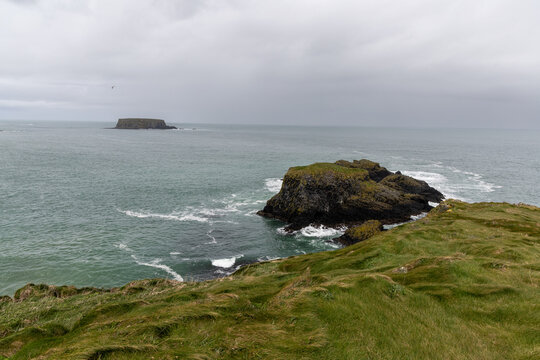 Scenic coastal landscape near Carrick-a-Rede Rope Bridge on the famous Causeway Coast Route in County Antrim, Northern Ireland