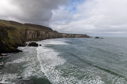 Stunning coastal cliffs and turquoise waters along the Northern Irish coast