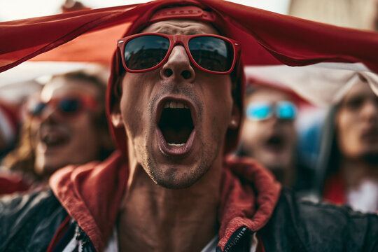 Passionate Sports Fan Shouting in Crowd at Stadium