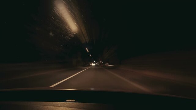 Cinematic night-time timelapse of a fast drive through a modern city
