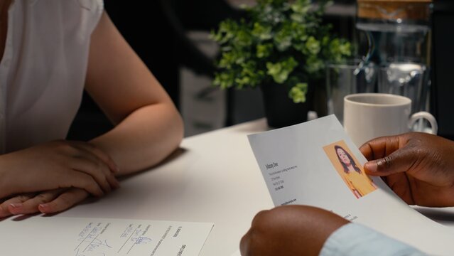 Job seeker signs a work contract after a successful interview while reviewing legal employment terms and completing the onboarding process.