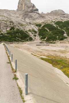 Canazei, Italy. Lago di Fedaia reservoir with exposed lakebed and dam wall during drought and very low water levels