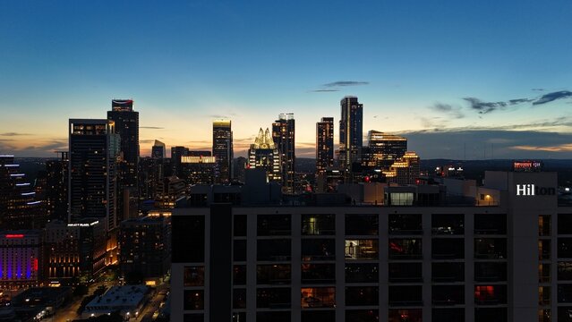 Aerial view of downtown city lights of while the sun is setting
