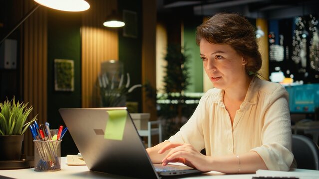Female entrepreneur makes a brilliant discovery with originality and finds an ingenious clever method to help with business development while raising a finger in an enlightenment or eureka gesture.
