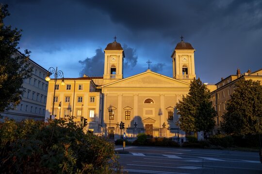 San Nicol&ograve; Greek Orthodox Church on the Riva del Mandracchio seafront in the evening light at sunset, dramatic clouds, Trieste, Friuli-Venezia Giulia region, Italy