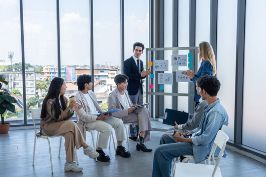 Successful happy workers Group of business people with Multiethnic workers with in company workers Group of asian business people and support Teamwork in the meeting room at modern office.