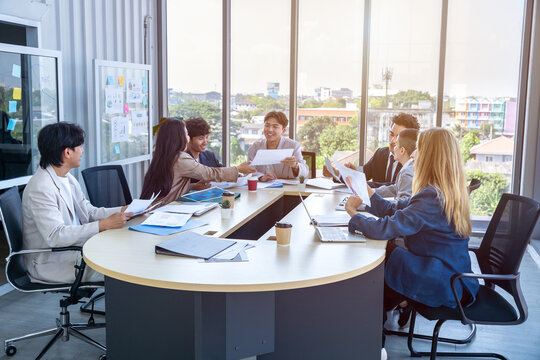 Successful happy workers Group of business people with Multiethnic workers with in company workers Group of asian business people and support Teamwork in the meeting room at modern office.