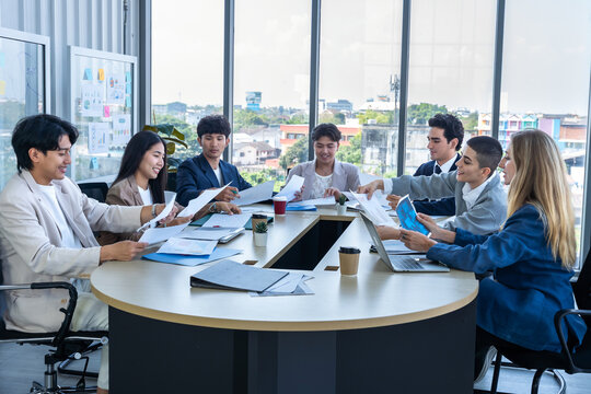 Successful happy workers Group of business people with Multiethnic workers with in company workers Group of asian business people and support Teamwork in the meeting room at modern office.