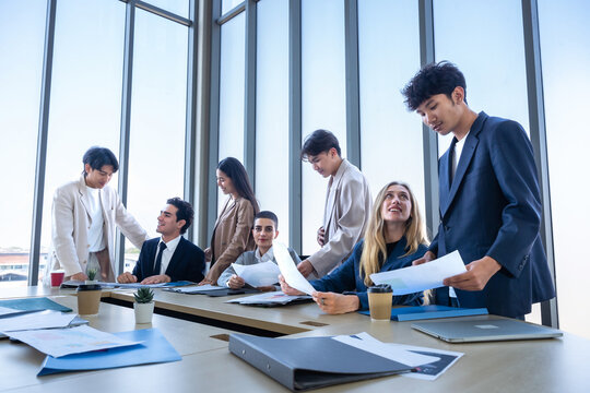 Successful happy workers Group of business people with Multiethnic workers with in company workers Group of asian business people and support Teamwork in the meeting room at modern office.