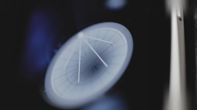Close view of large parabolic tracking antenna