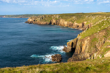 Naklejka premium Granite cliffs along the rocky coastline of Land's End, Cornwall, England.