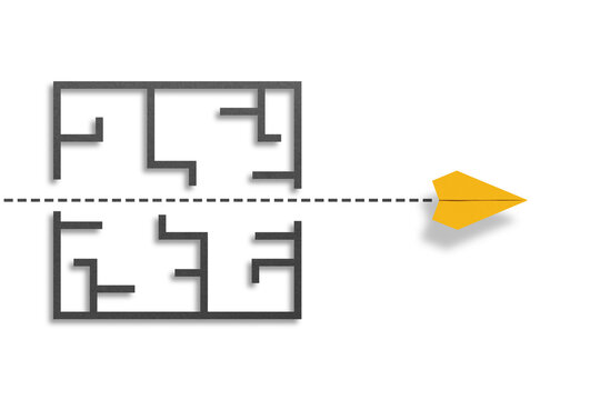 Overcoming obstacles and challenges. The way to success and business solutions. A yellow paper plane breaking through the maze on white background.