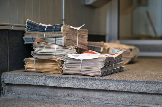 Lareg newspaper delivery at front door