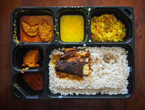 South Indian Fish Meal Box with Rice, Curry, Fry and Sambar in Takeaway Tray