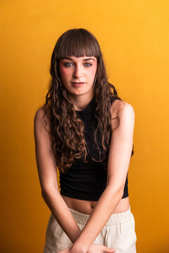 Young woman dancer posing confident with curly hair