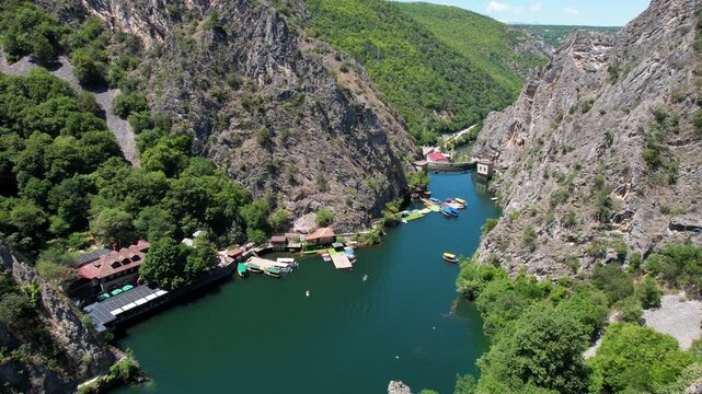 Aerial drone footage of Matka Canyon near Skopje, showcasing stunning mountains and the river. Perfect for projects seeking dramatic natural landscapes. Aerial panoramic drone view from above, top vie