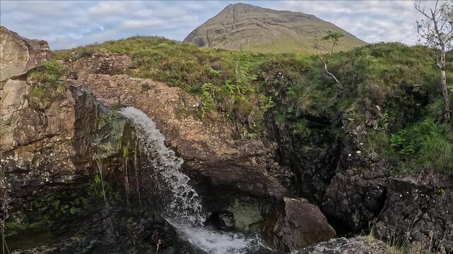Tall waterfall at the Fairy Pools, Isle of Skye