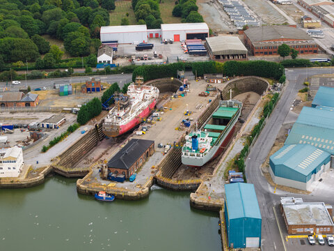 Cargo Ships Undergo Maintenance at a Busy Birkenhead Shipyard