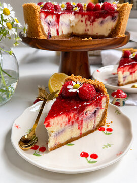 Fresh Raspberry Cheesecake Slice with Graham Cracker Crust and Coulis