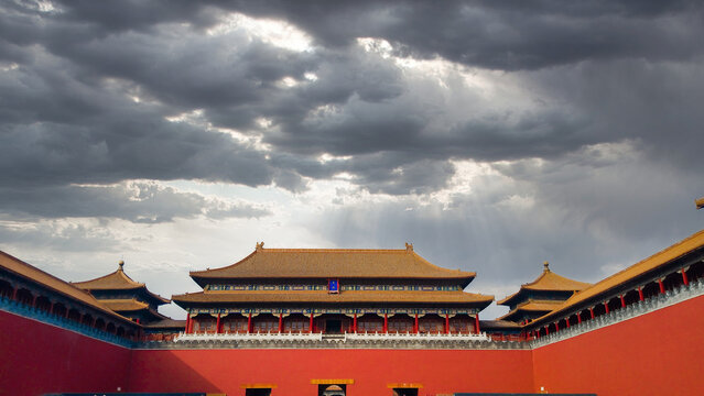 Majestic Forbidden City Palace in Beijing Under Dramatic Cloudy Sky with Sun Rays