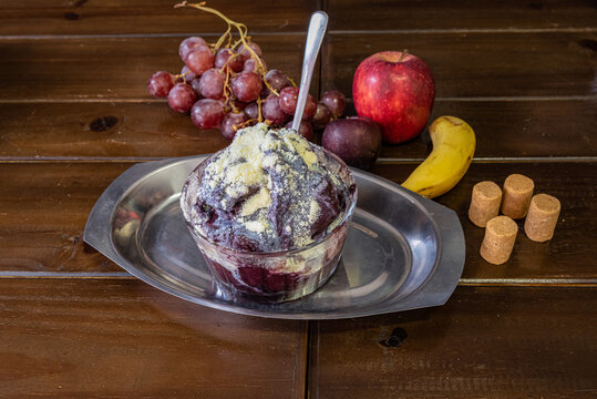 Acai Bowl with Fruit on Wooden Table