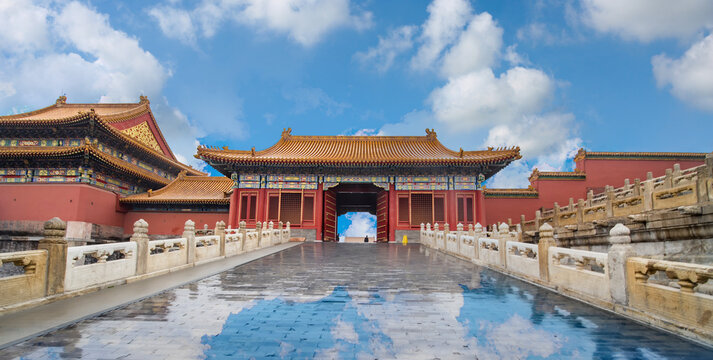 Forbidden City in Beijing, China, Traditional Imperial Palace Architecture with Red Walls and Golden Roofs Under a Blue Sky