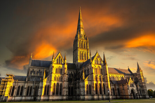 Salisbury Cathedral at Dramatic Golden Sunset in Salisbury, Wiltshire, England, UK