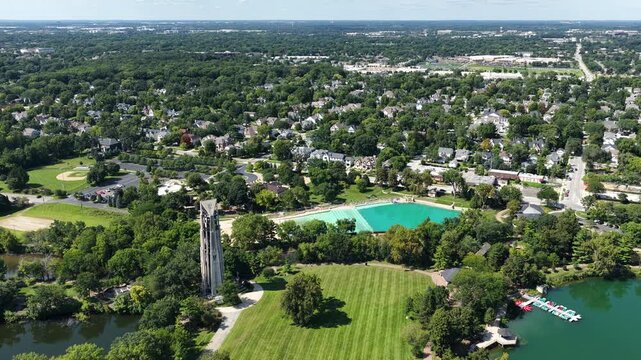 Aerial View of Naperville Neighborhood with Carillon Tower, Pool, and River