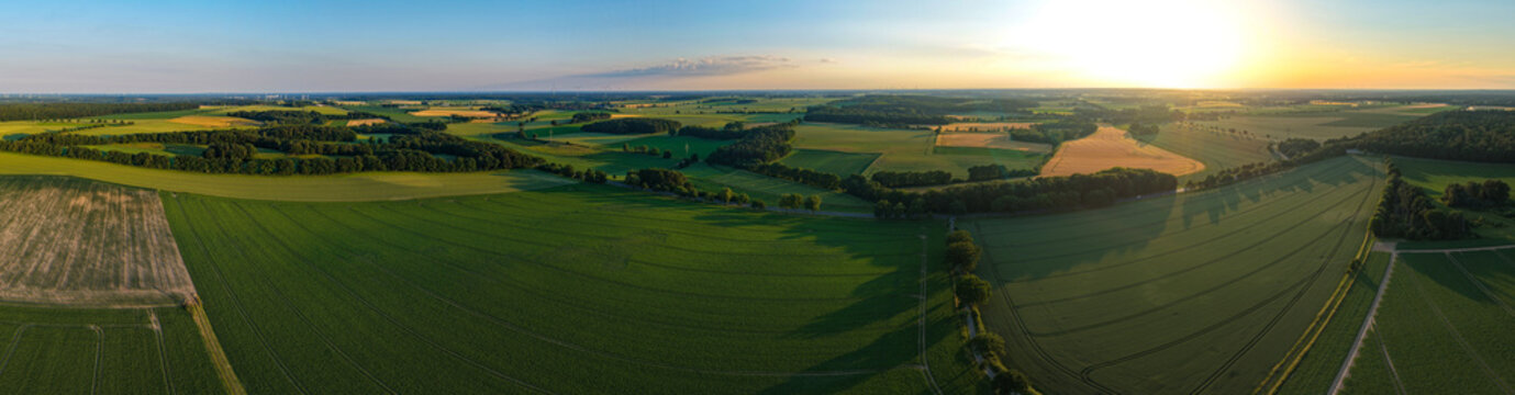 Aerial field panorama. Farming landscape panorama. Aerial rural countryside landscape with farmland field. Panoramic agricultural land and natural landscape. Panoramic aerial field, farm