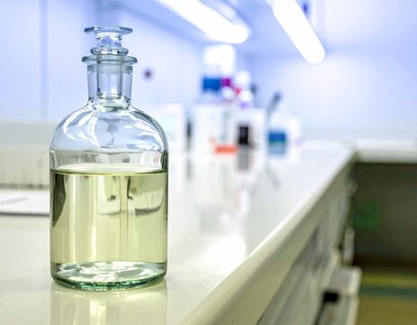 Medical alcohol bottle with liquid inside-half full.Medical concept.