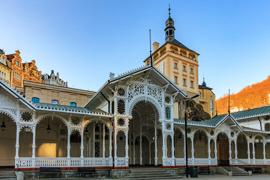 Ornate white colonnade and historic architecture in karlovy vary at sunset. March 18, 2025, Karlovy Vary, Czech Republic