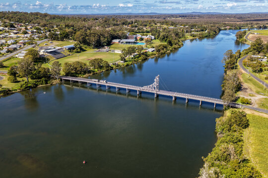 Aerial view of the bridge crossing the Clarence River at Maclean, showing the broad river, transport infrastructure and surrounding town and rural landscape in the Northern Rivers