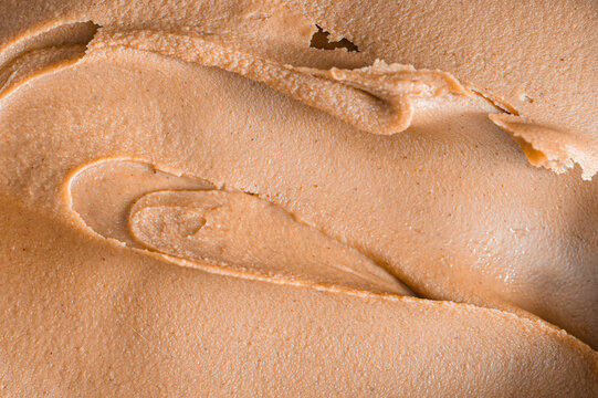 Swirl of creamy peanut butter, full frame