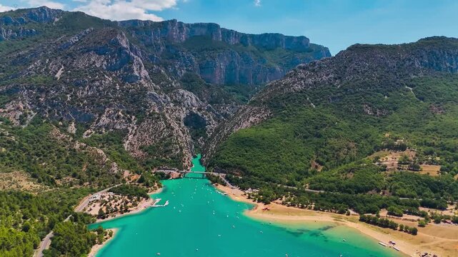 Aerial drone view of the turquoise Verdon River flowing through the Verdon Gorge river canyon in the Provence-Alpes-Cote d'Azur region of southeastern France. High quality 4k footage