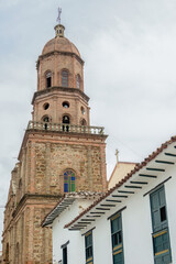 Fototapeta premium The old colonial style tower of the main church of the town of Curiti