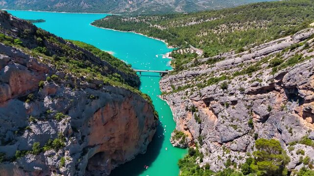 Aerial drone view of the turquoise Verdon River flowing through the Verdon Gorge river canyon in the Provence-Alpes-Cote d'Azur region of southeastern France. High quality 4k footage