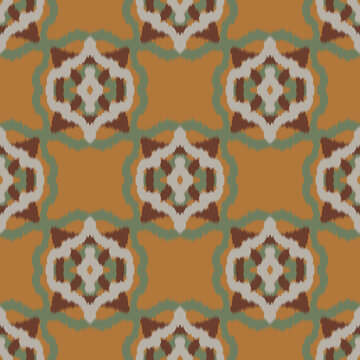 Seamless ethnic ikat pattern with ochre yellow green ogee medallion ornament. Embroidered stitch texture design for bohemian fabric, textile, apparel, wallpaper, and background.
