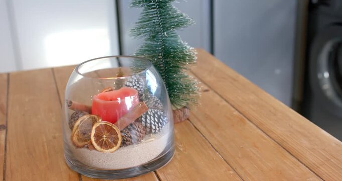 Camera is tilting to reveal glass bowl gingerbread cookies on table showcasing decor