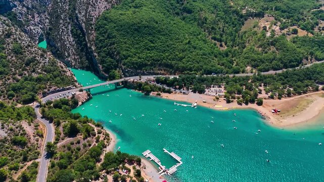 Aerial drone view of the turquoise Verdon River flowing through the Verdon Gorge river canyon in the Provence-Alpes-Cote d'Azur region of southeastern France. High quality 4k footage