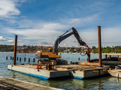Excavator Working On Pontoon Afloat