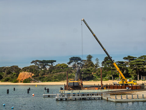 Pier Construction Excavater And Tall Mobile Crane