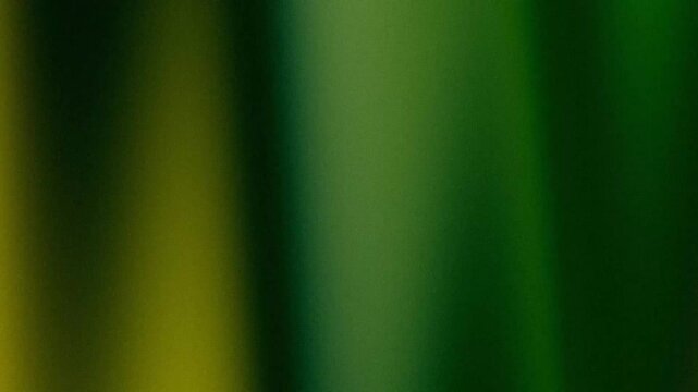 Dark moody gradient background with yellow, green and blue grain texture
