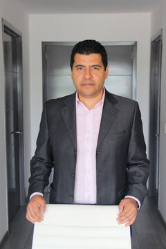 40-year-old Latino executive with a dark skin, successful leader of his business and finance venture