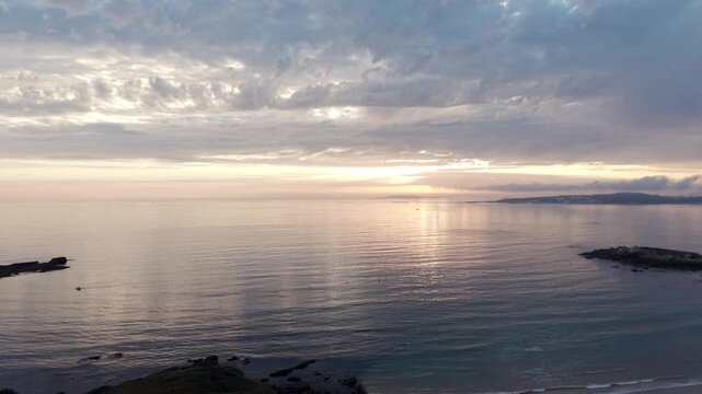 Sunset aerial view over Praia de Paxos and calm Atlantic ocean in Galicia Spain