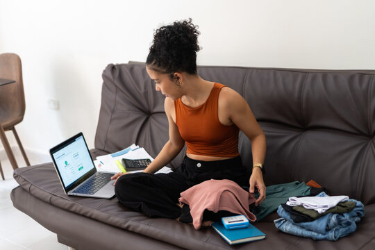 Woman working from home managing online clothing business